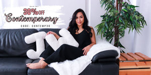 Woman sitting on a couch with promotional text of 30% Off Contemporary Collection. Use Code: CONTEMP30