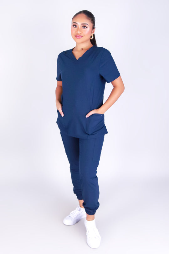 BACK AT IT SCRUB TOP