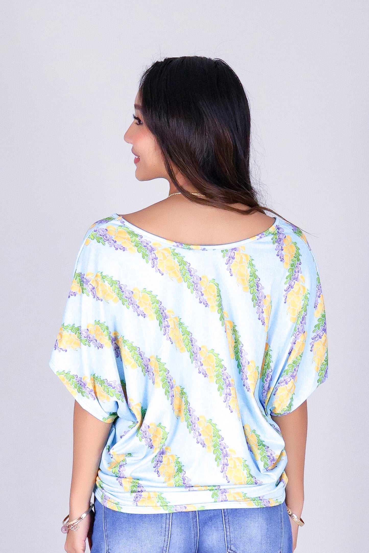 TWISTED LEI DOLMAN TOP