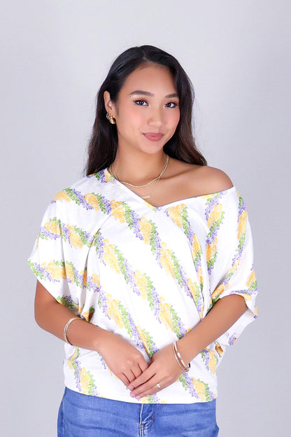 TWISTED LEI DOLMAN TOP