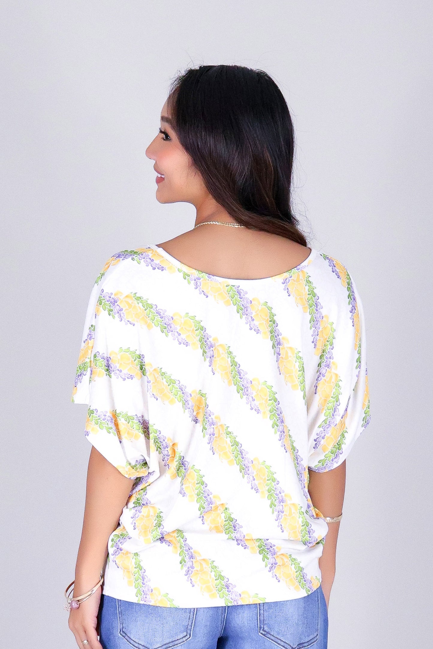 TWISTED LEI DOLMAN TOP