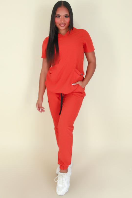 BACK AT IT SCRUB TOP