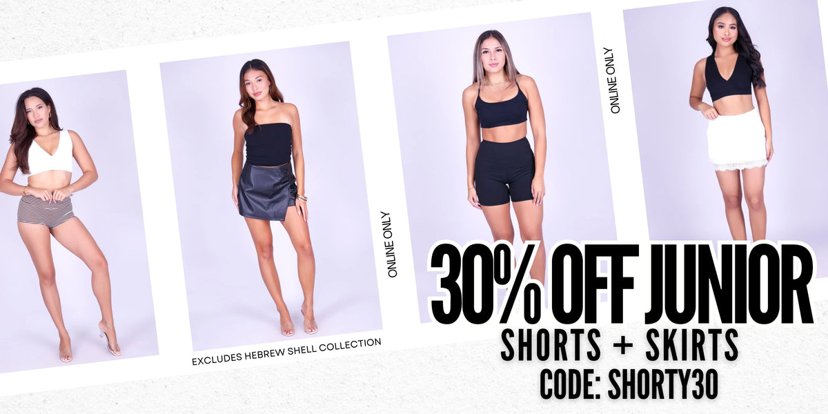 Promotional banner showing four female models wearing different athletic shorts and skirt outfits against a light background, with large text reading '30% OFF JUNIOR SHORTS + SKIRTS', 'CODE: SHORTY30', and 'Excludes Hebrew Shell Collection.